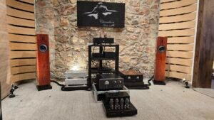a group of speakers and a rack